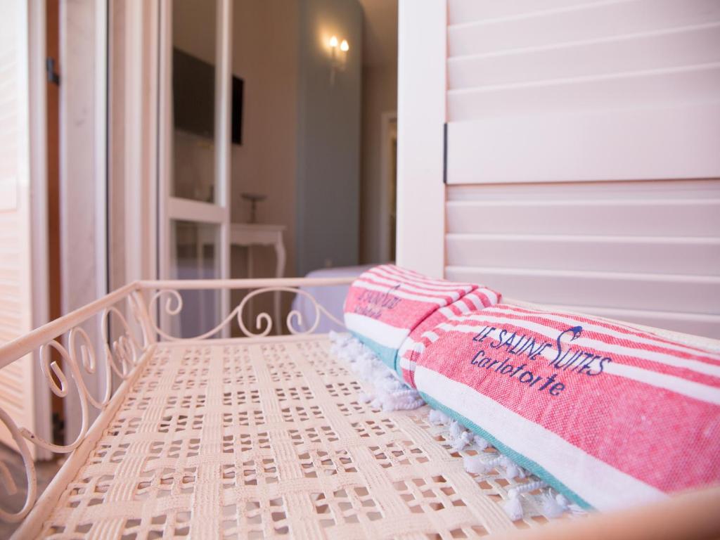 Postel nebo postele na pokoji v ubytování Le Saline Suites