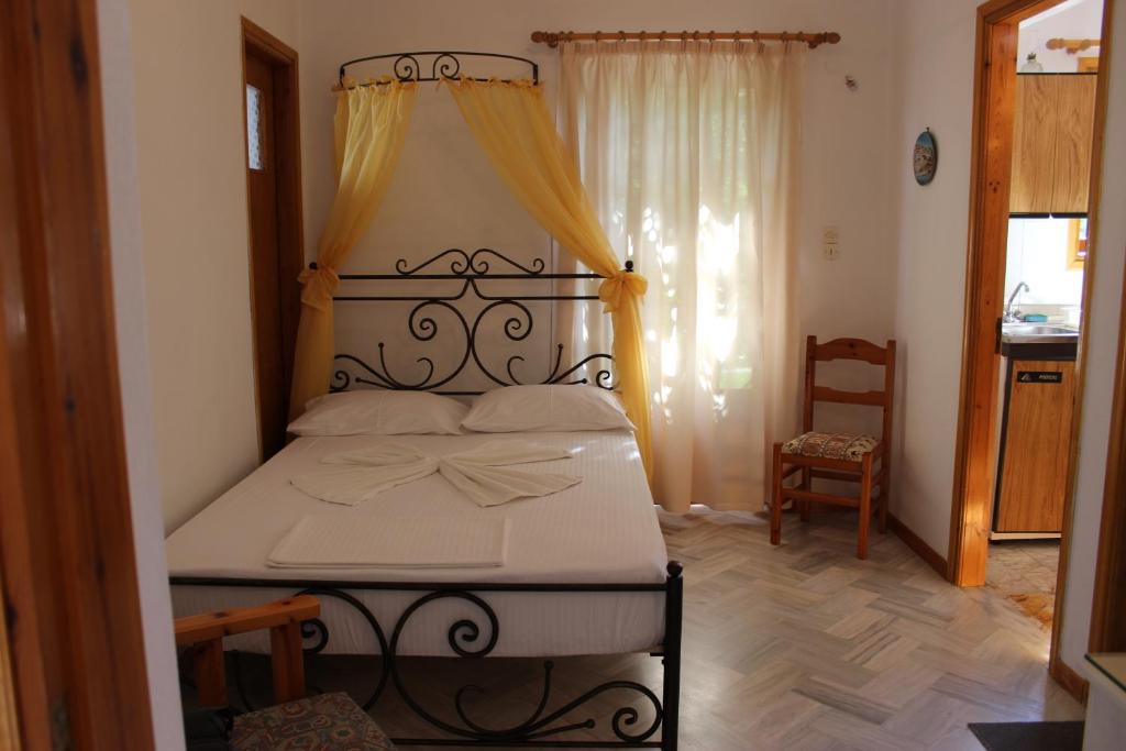 Postel nebo postele na pokoji v ubytování Olympion Apartments