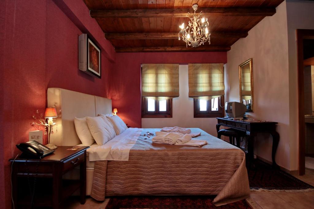 Postel nebo postele na pokoji v ubytování Menalia Villas & Suites ΚΤΗΜΑ ΚΟΥΜΠΟΥΡΗ