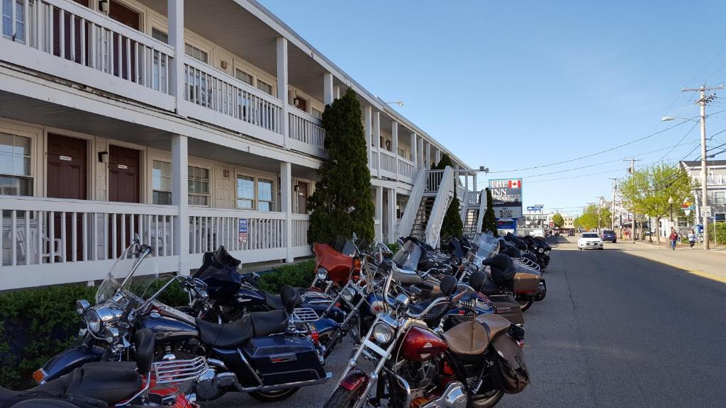 a row of motorcycles parked in front of a building at The Inn at Soho Square in Old Orchard Beach