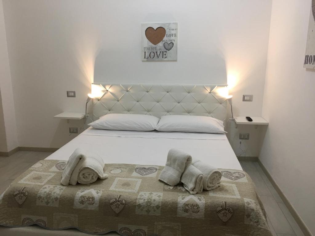 Postel nebo postele na pokoji v ubytování B&B ARCHIMEDE