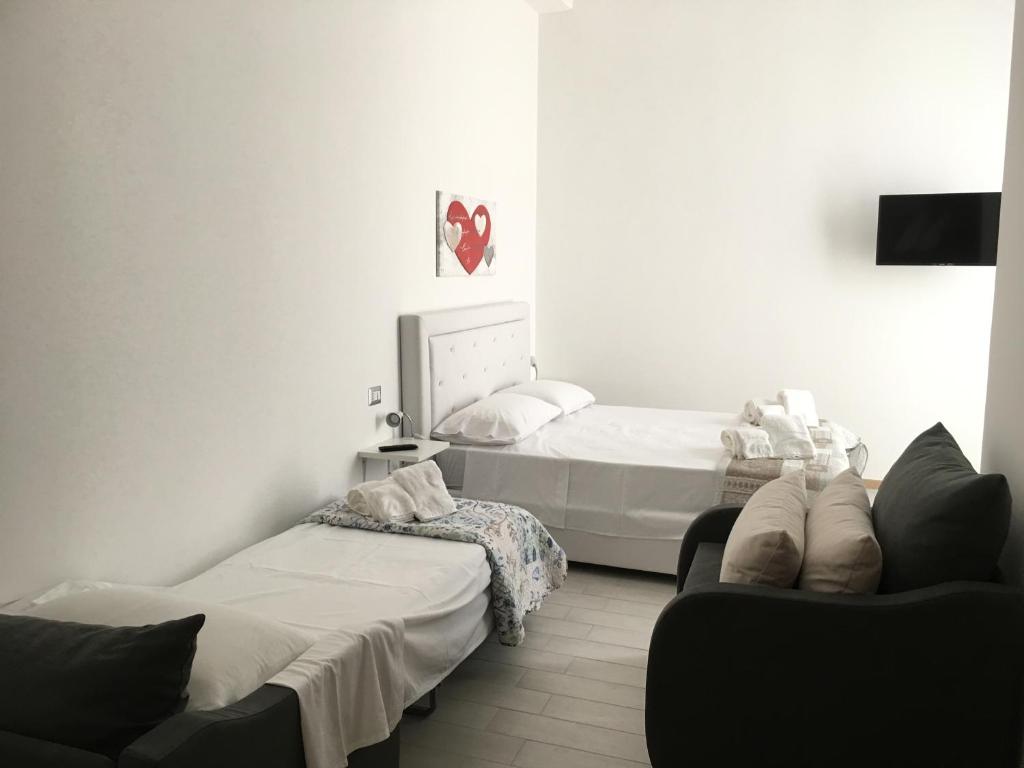 Postel nebo postele na pokoji v ubytování B&B ARCHIMEDE