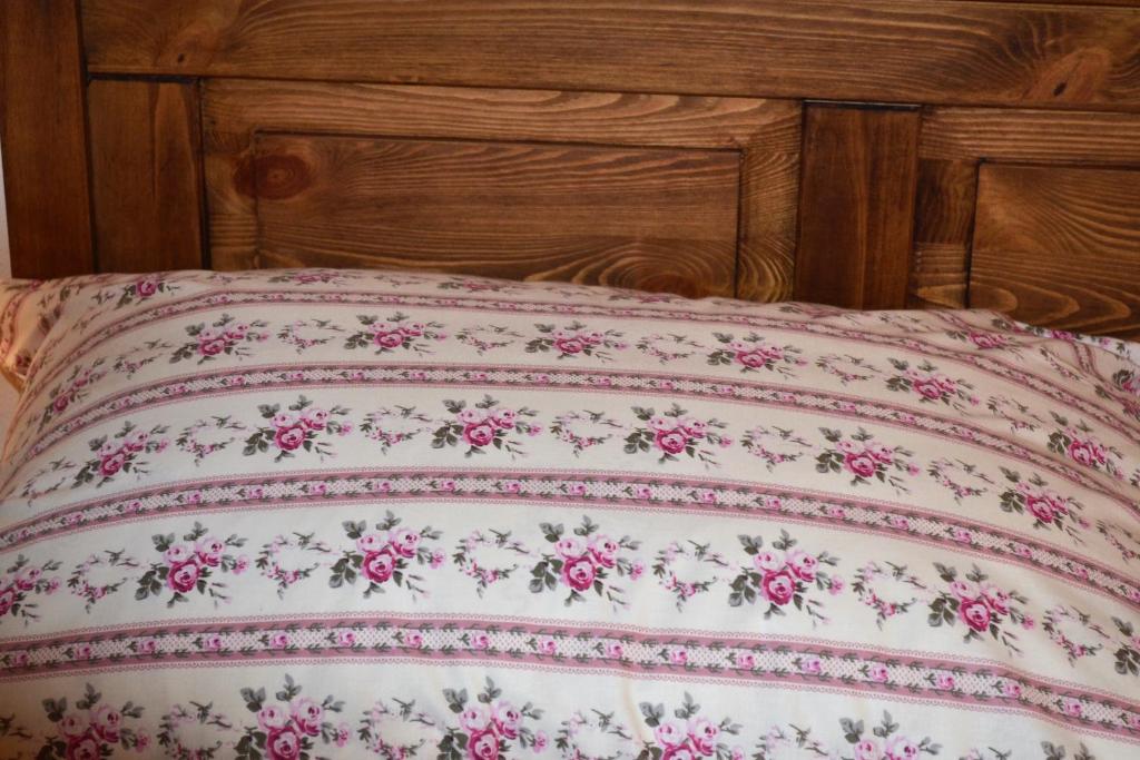 A bed or beds in a room at Penzión Thamasy