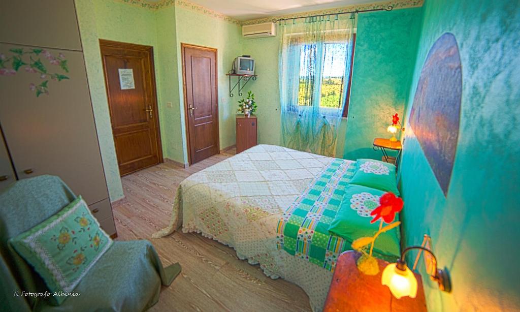 Łóżko lub łóżka w pokoju w obiekcie Agriturismo La Valle degli Ulivi