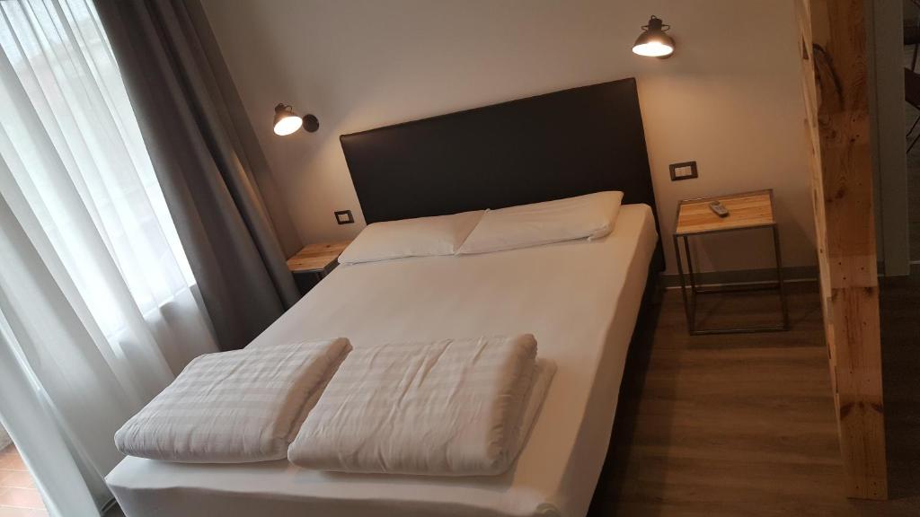 Postel nebo postele na pokoji v ubytování Hotel Anna