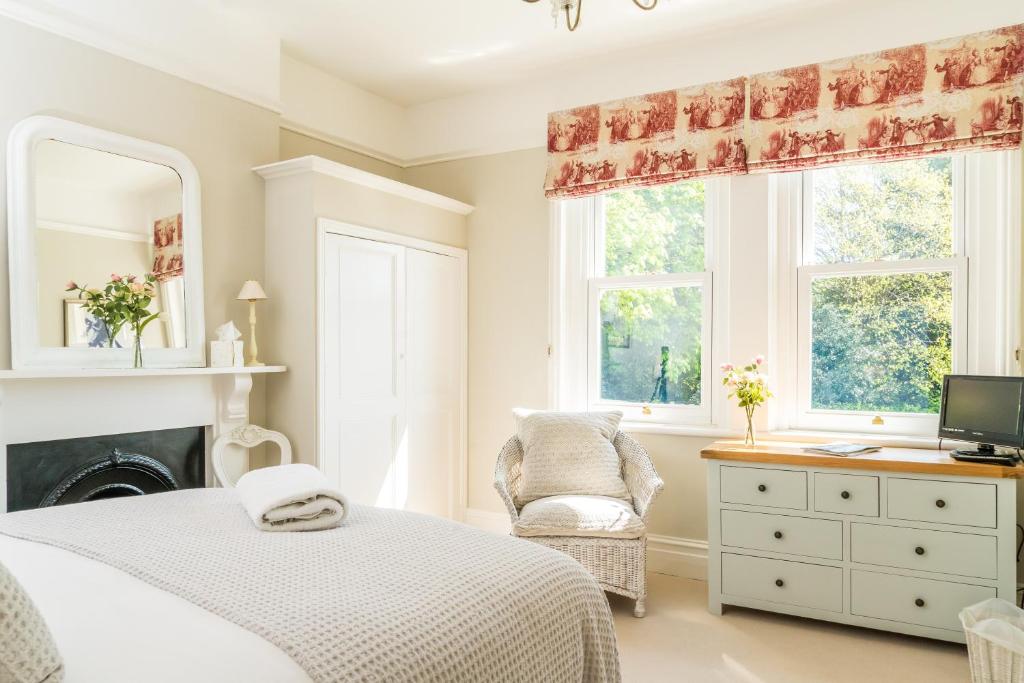 A bed or beds in a room at The Firs 