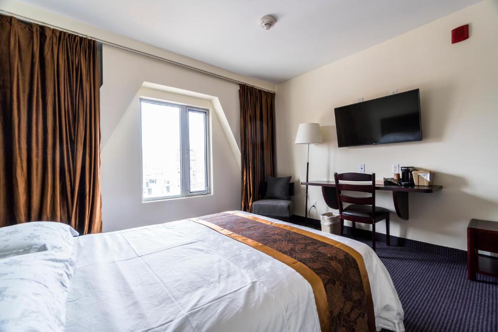 Postel nebo postele na pokoji v ubytování John Hotel