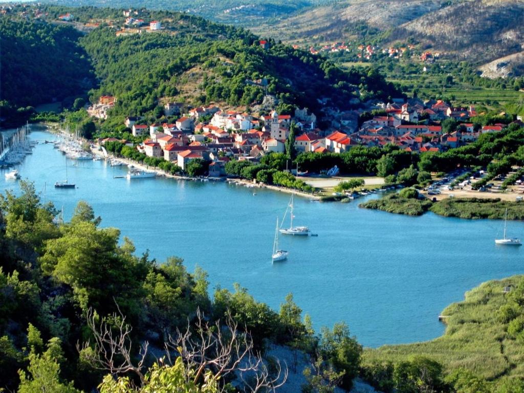an aerial view of a river with boats in it at Guest House Željko Klarić in Skradin