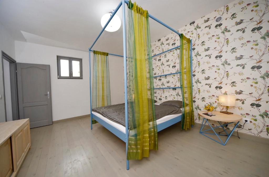 Posteľ alebo postele v izbe v ubytovaní SárgaRigó Holiday Home