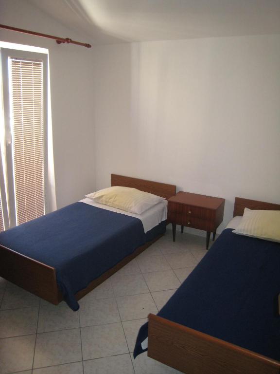Postel nebo postele na pokoji v ubytování Apartments Selez