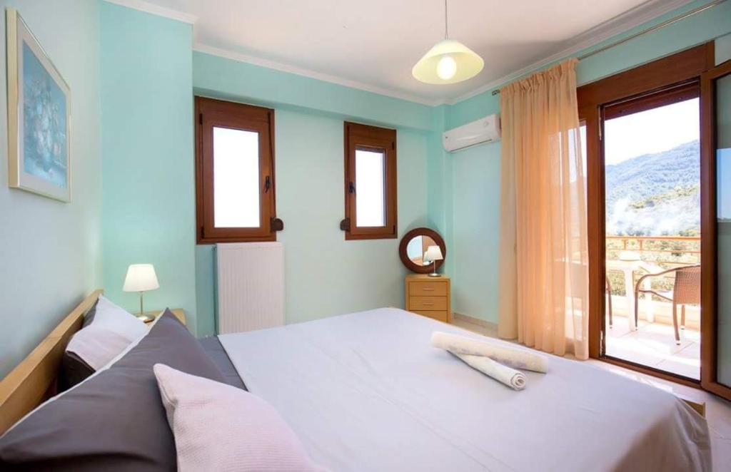 Voodi või voodid majutusasutuse Aphrodite Villas toas