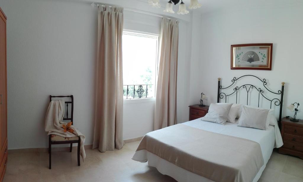 Giường trong phòng chung tại El Mirador de Vejer