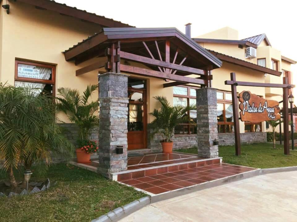 a building with a welcoming entrance to a restaurant at Piedra de Agua in Federación