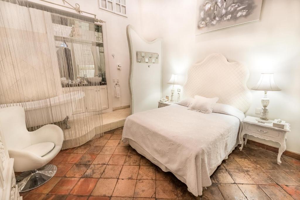 Postel nebo postele na pokoji v ubytování Casa Pedro Loza
