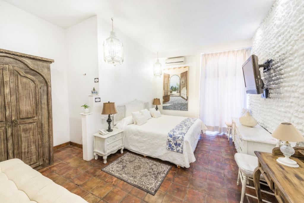 Postel nebo postele na pokoji v ubytování Casa Pedro Loza