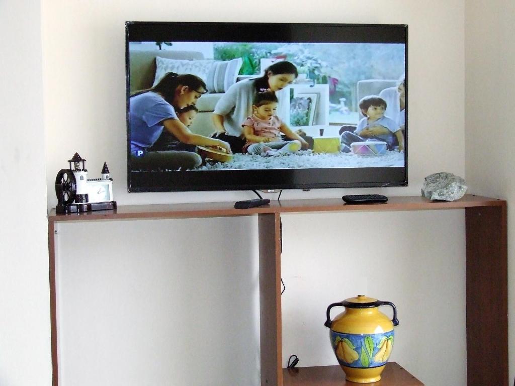TV a/nebo společenská místnost v ubytování Dulce Hogar