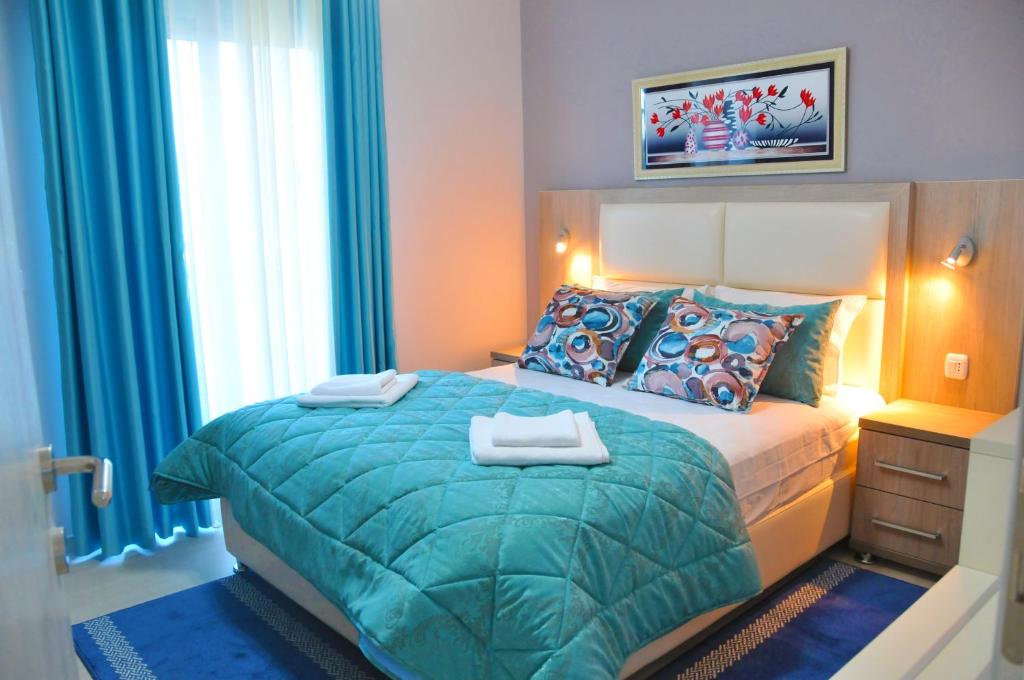 Posteľ alebo postele v izbe v ubytovaní Ambassador & Ambassador Lux Apartments