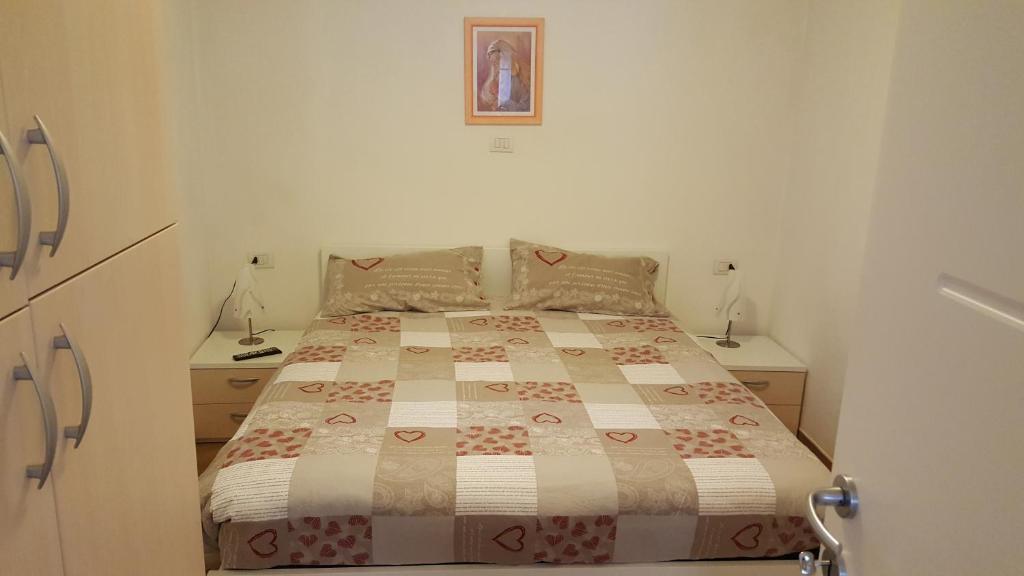Łóżko lub łóżka w pokoju w obiekcie Casa Di Girolamo