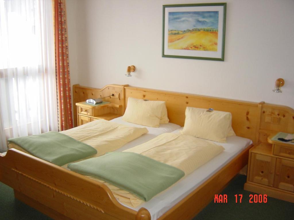 Ένα ή περισσότερα κρεβάτια σε δωμάτιο στο Hotel Sporthof Austria