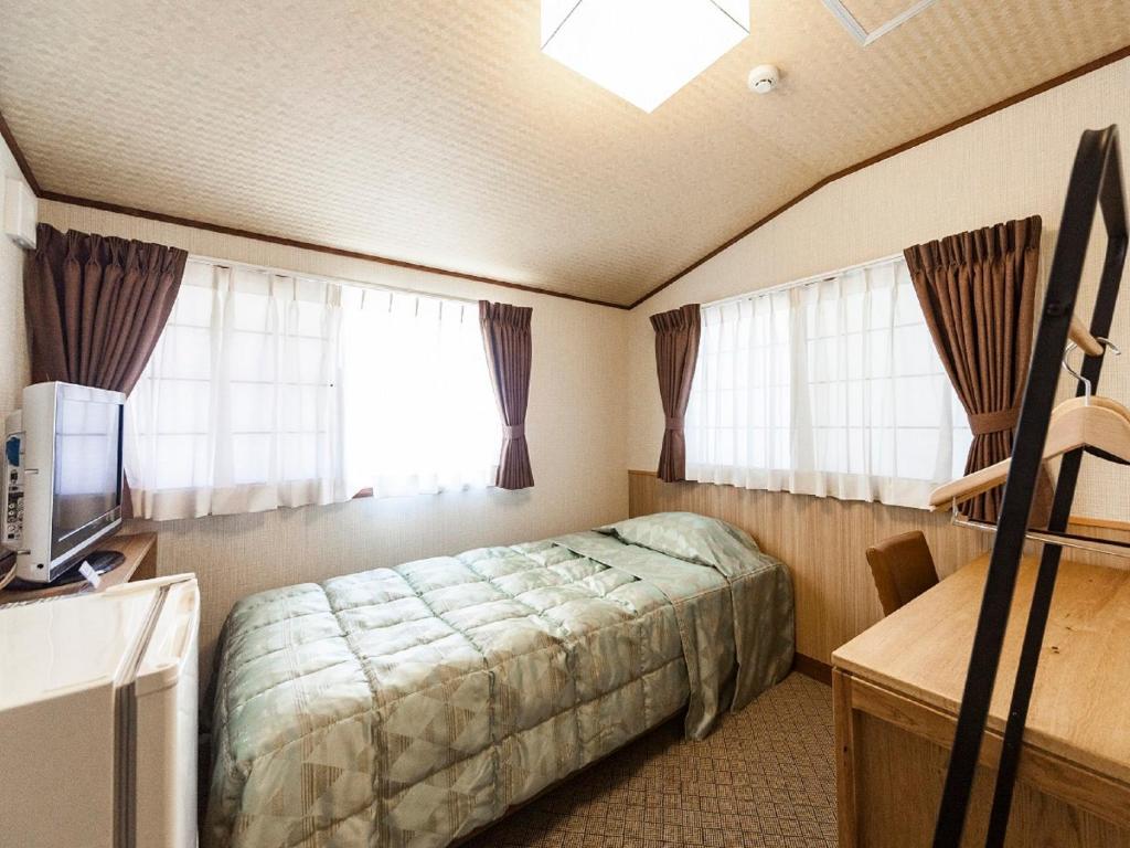 TV a/nebo společenská místnost v ubytování Onsen Guest House Aobato no Su