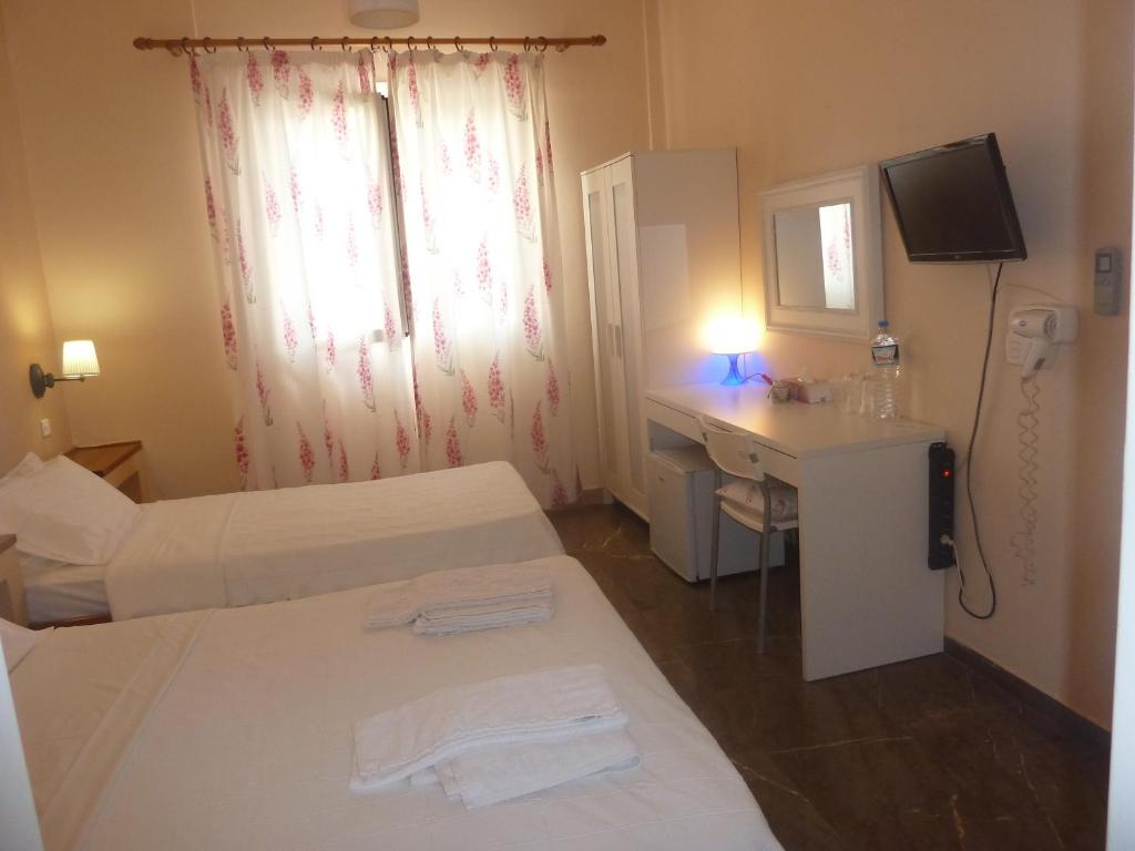 Łóżko lub łóżka w pokoju w obiekcie Zoe Pension
