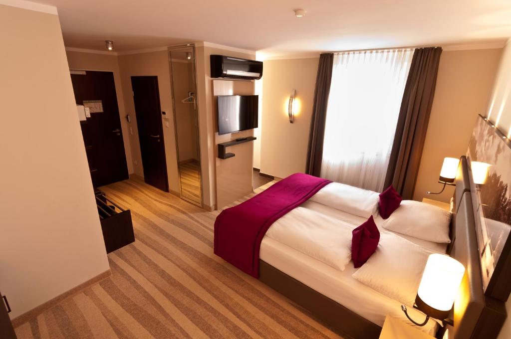 Postel nebo postele na pokoji v ubytování Amalienburg - Boutique & Boarding Hotel