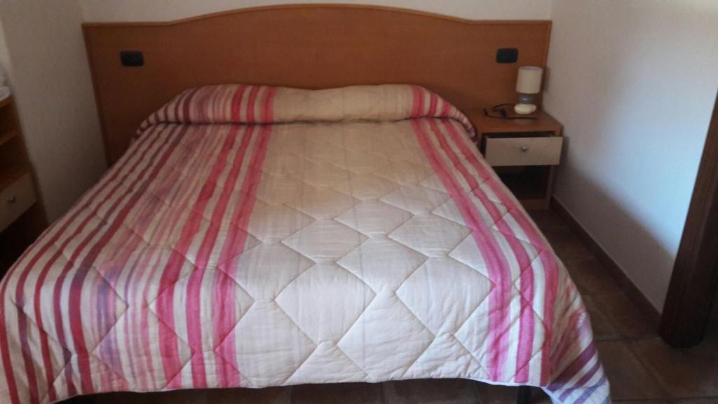 Postel nebo postele na pokoji v ubytování Affittacamere L'Airone
