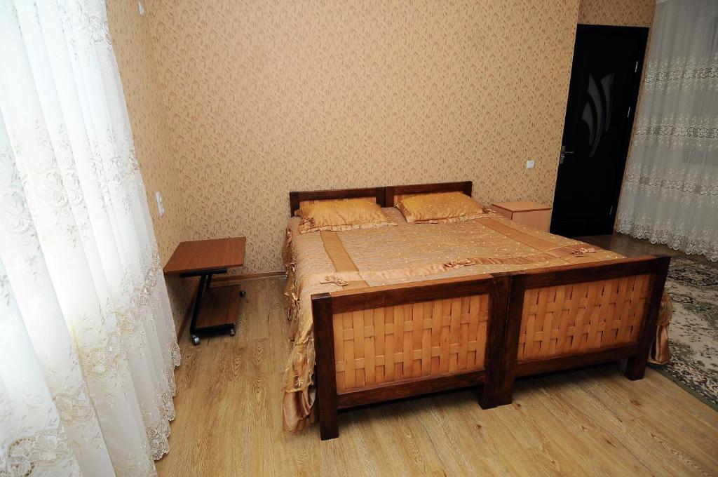Postel nebo postele na pokoji v ubytování Guest House Darejani