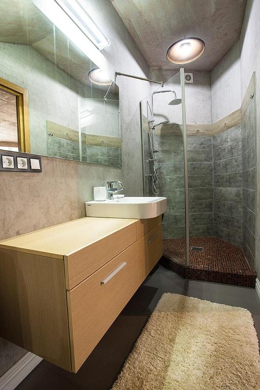 a bathroom with a sink and a shower at Apartment near the sea in Gribovka