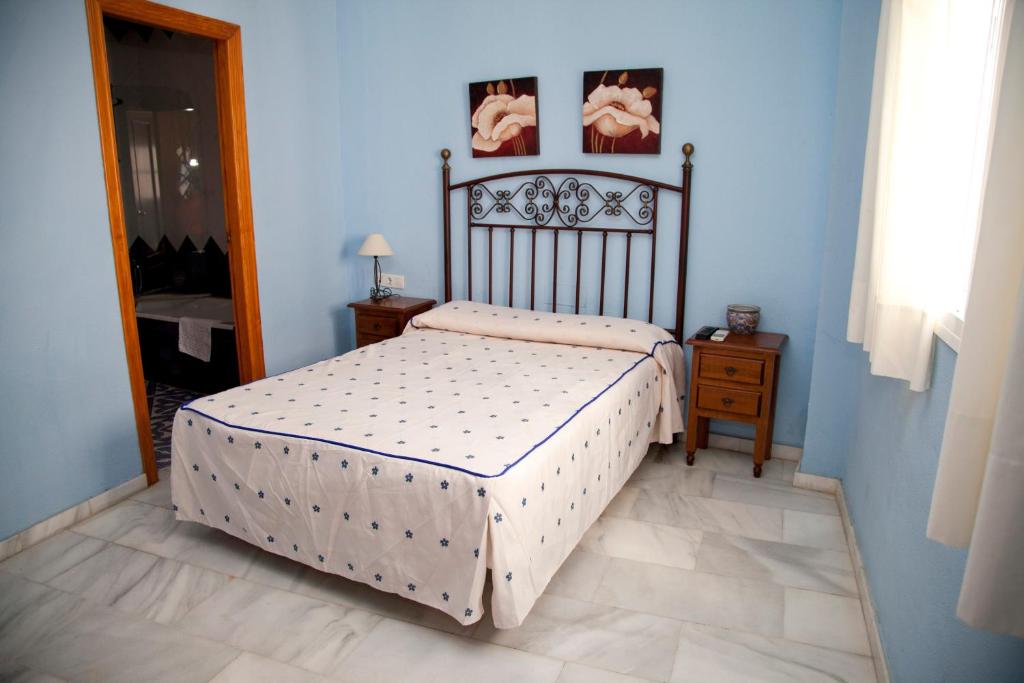 Posteľ alebo postele v izbe v ubytovaní Hostal Niza