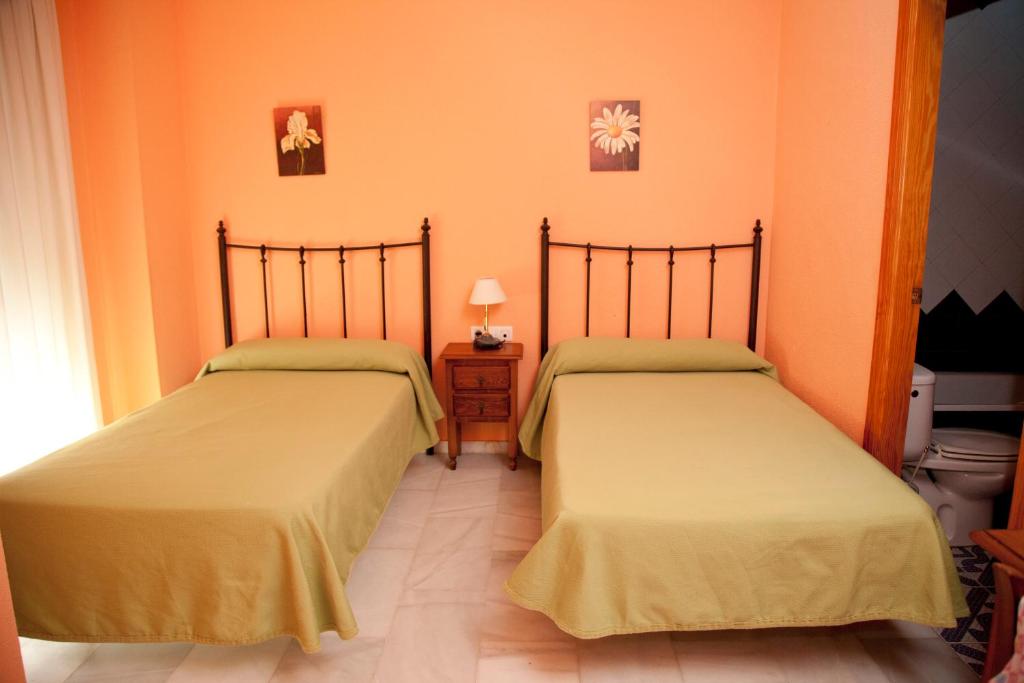 Posteľ alebo postele v izbe v ubytovaní Hostal Niza