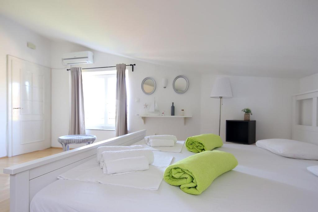 Ένα ή περισσότερα κρεβάτια σε δωμάτιο στο Apartments Papalinna