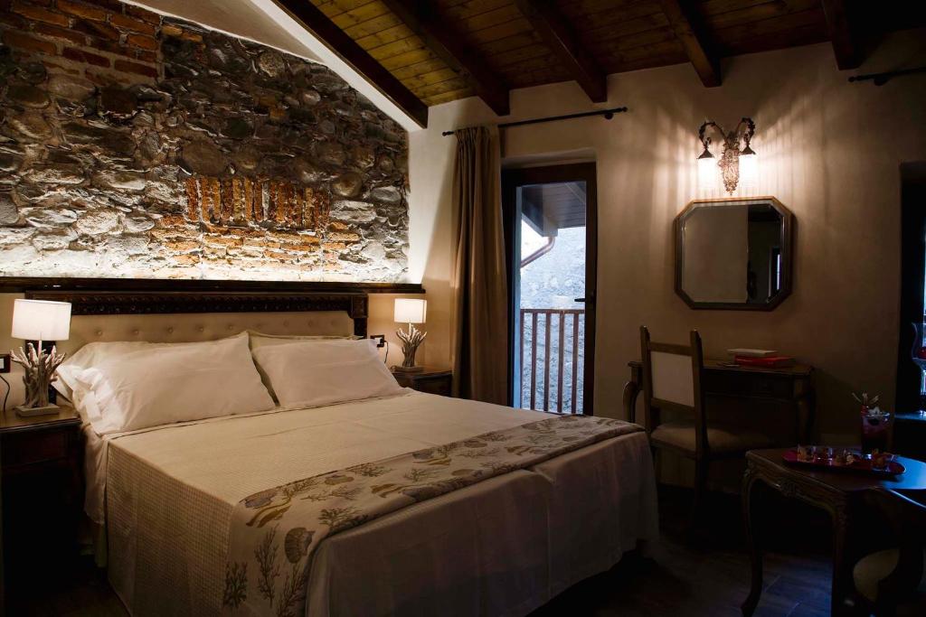 Postel nebo postele na pokoji v ubytování Boutique Hotel Elvezia