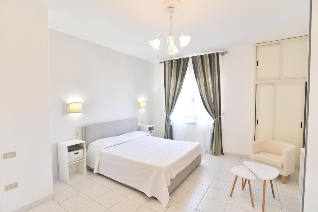 Posteľ alebo postele v izbe v ubytovaní Villa Elisabetta Apartments