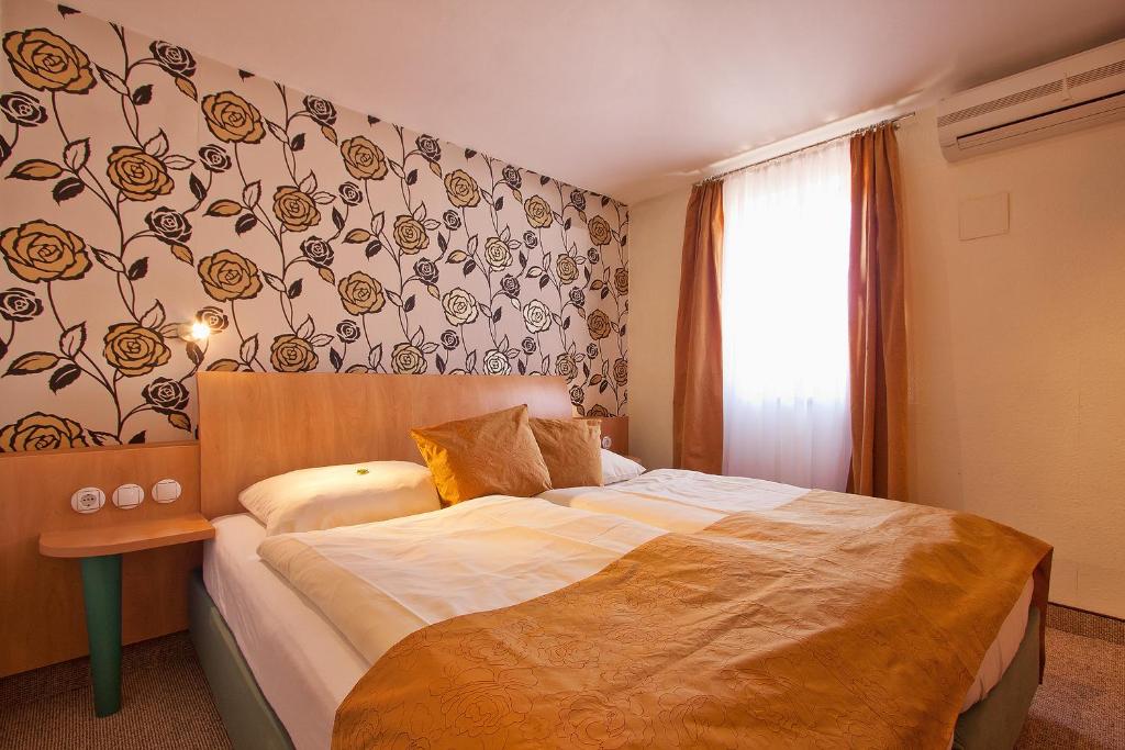 Postel nebo postele na pokoji v ubytování Hotel Scaletta