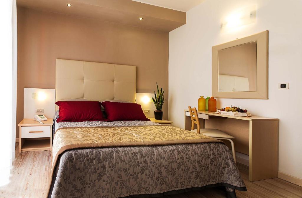 Postel nebo postele na pokoji v ubytování Hotel Torino