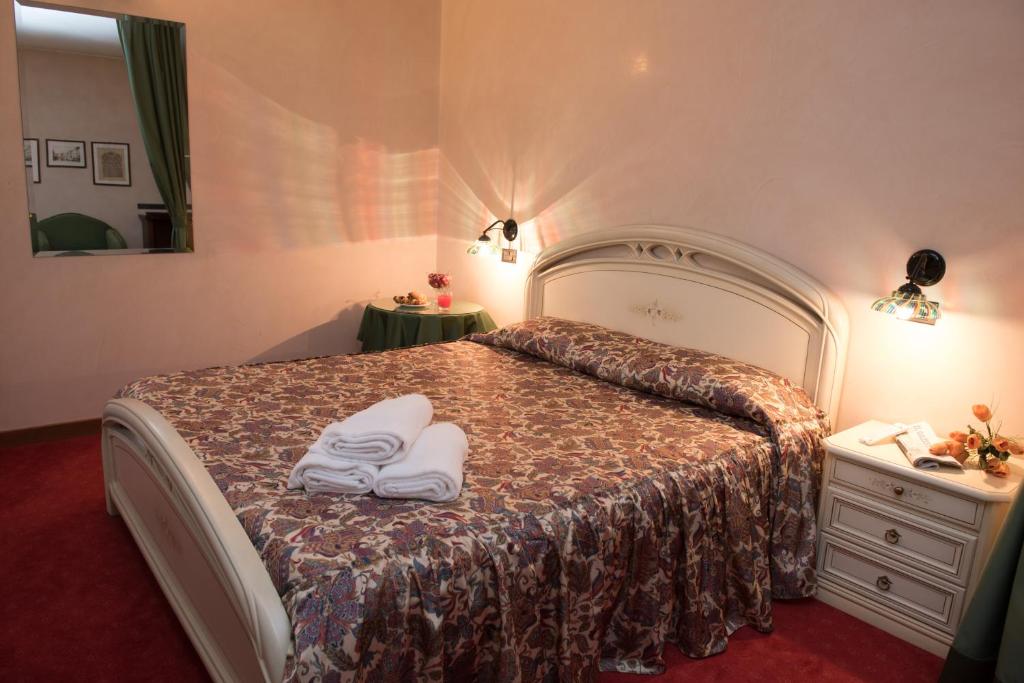 Posteľ alebo postele v izbe v ubytovaní Hotel Tessarin
