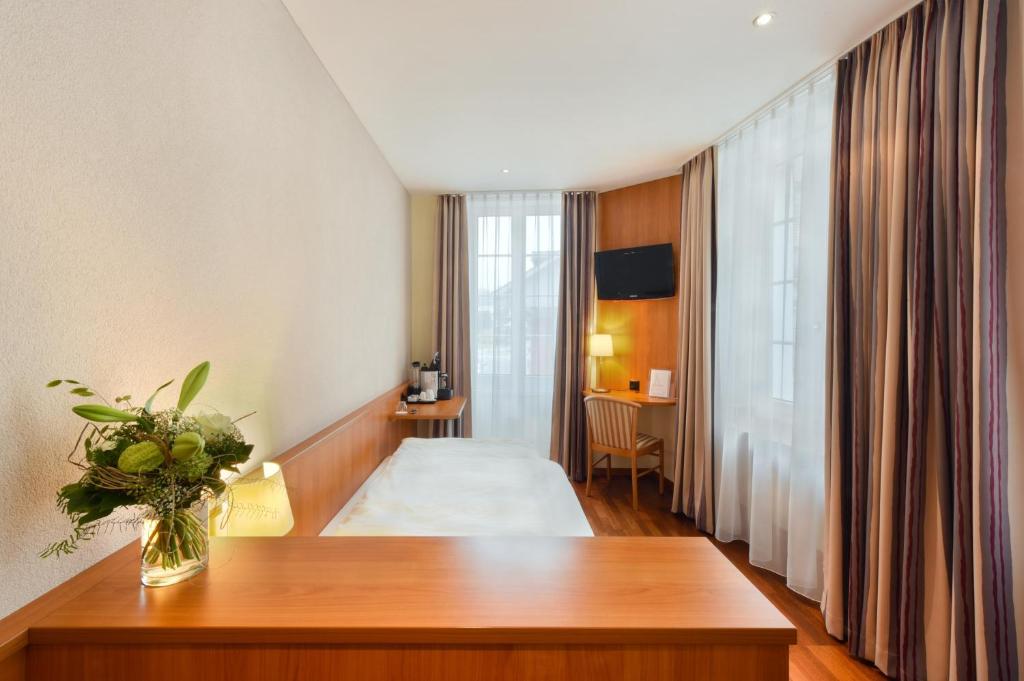 Postel nebo postele na pokoji v ubytování Apart Hotel Amadeo