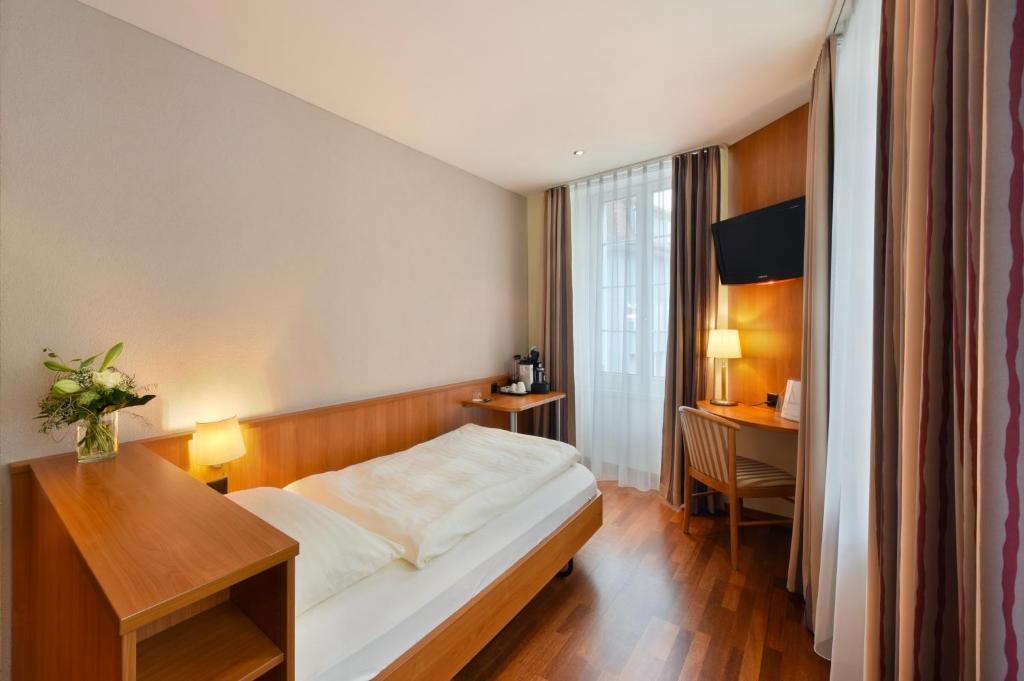 Postel nebo postele na pokoji v ubytování Apart Hotel Amadeo