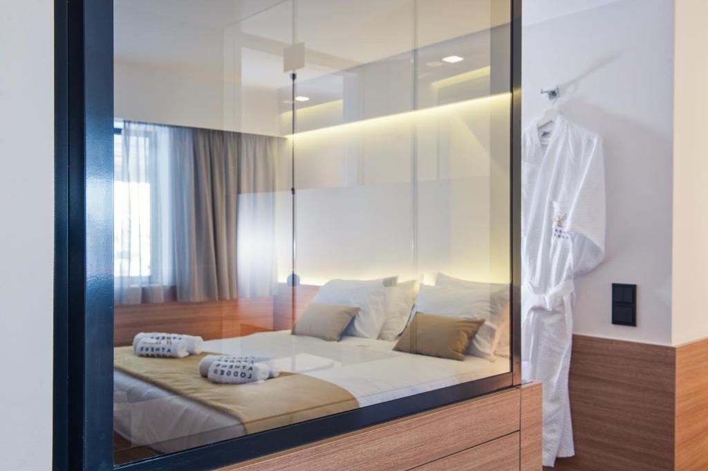 Postel nebo postele na pokoji v ubytování Athens Lodge by Athens Prime Hotels