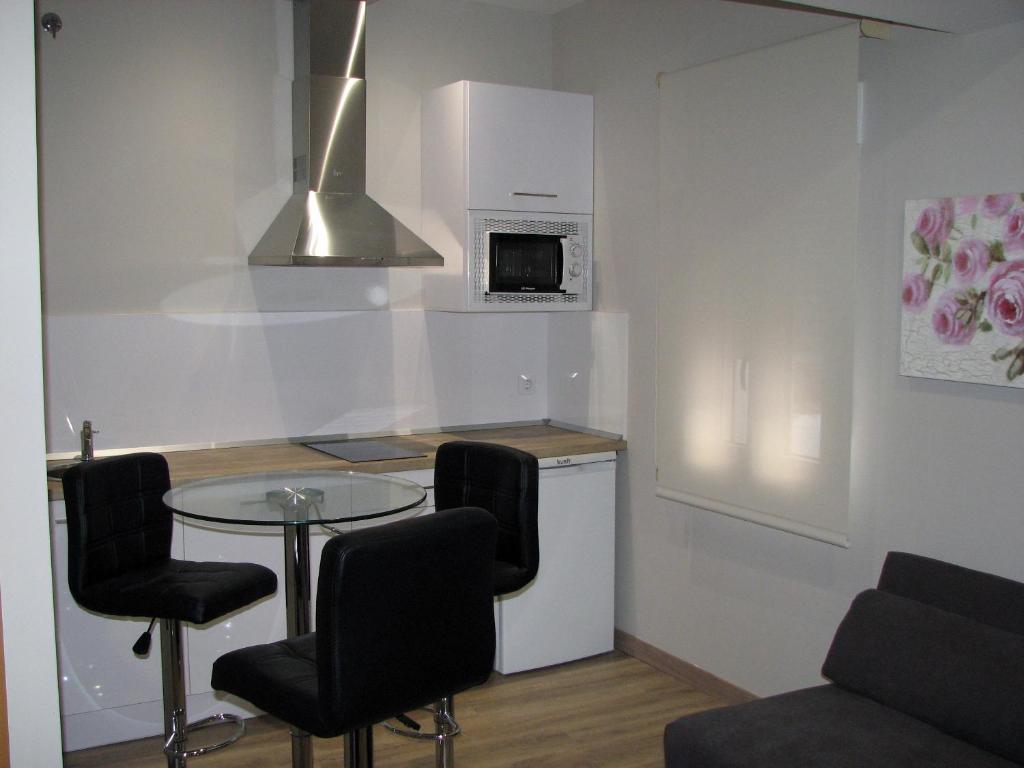 Kuchyň nebo kuchyňský kout v ubytování Apartamentos Mitreo