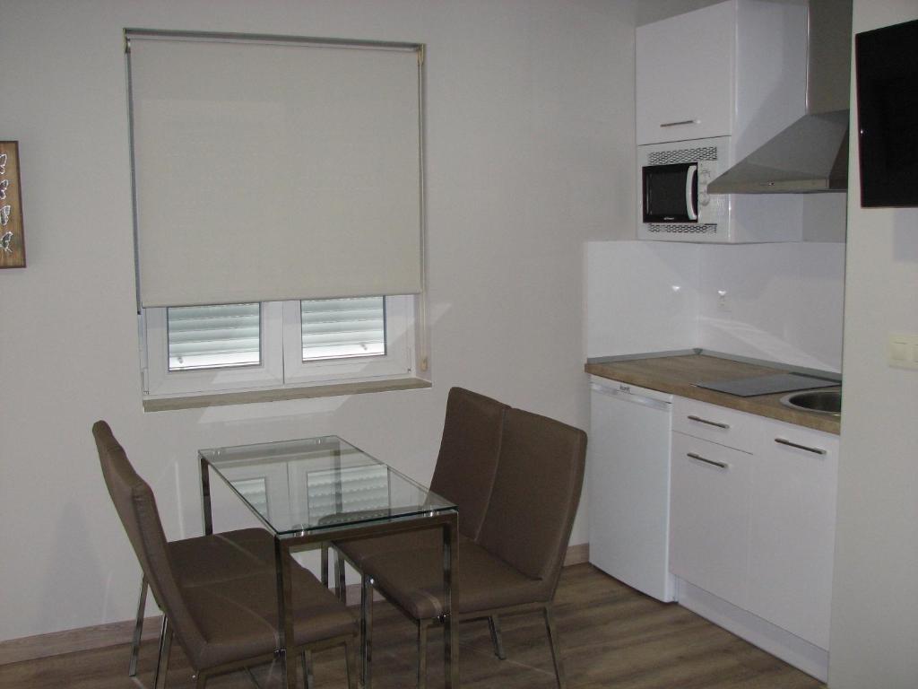 Kuchyň nebo kuchyňský kout v ubytování Apartamentos Mitreo