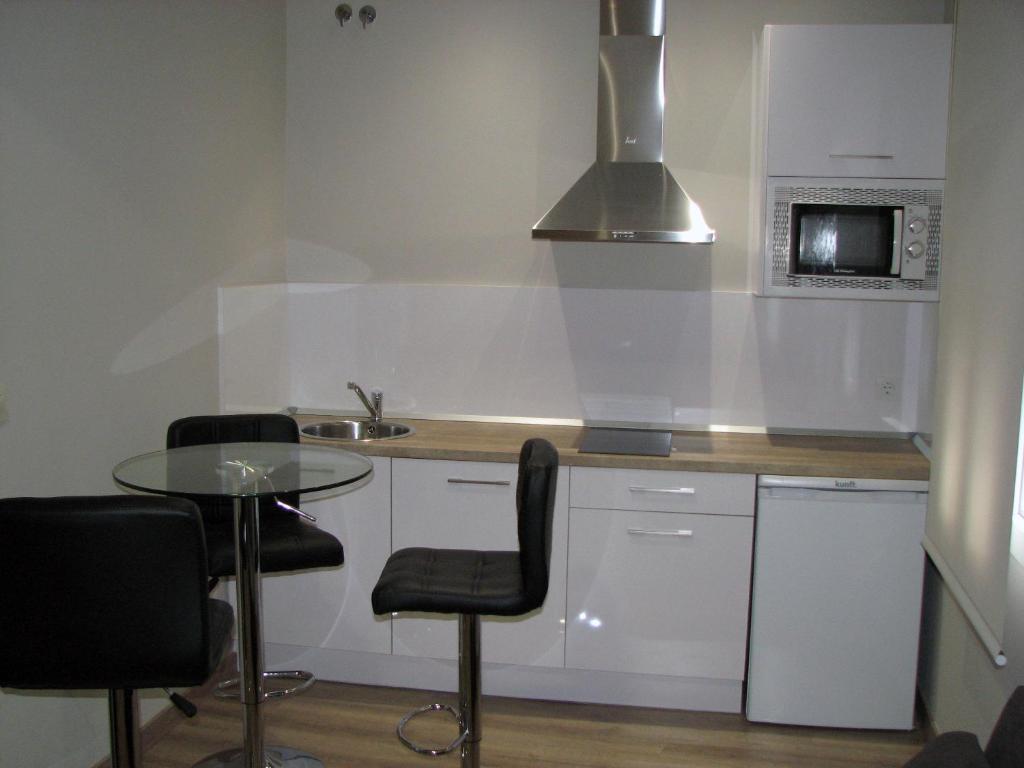 Kuchyň nebo kuchyňský kout v ubytování Apartamentos Mitreo