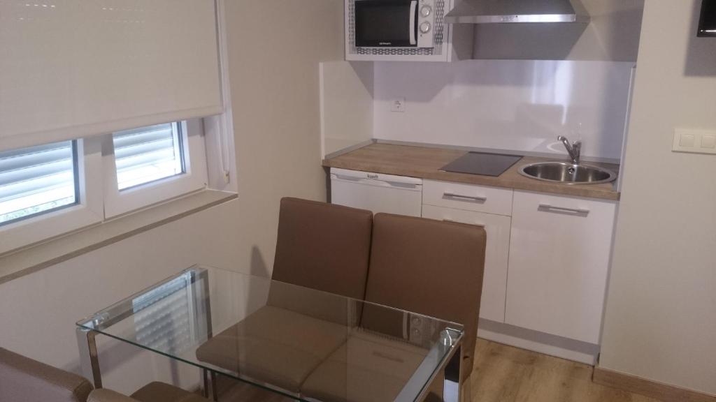 Kuchyň nebo kuchyňský kout v ubytování Apartamentos Mitreo