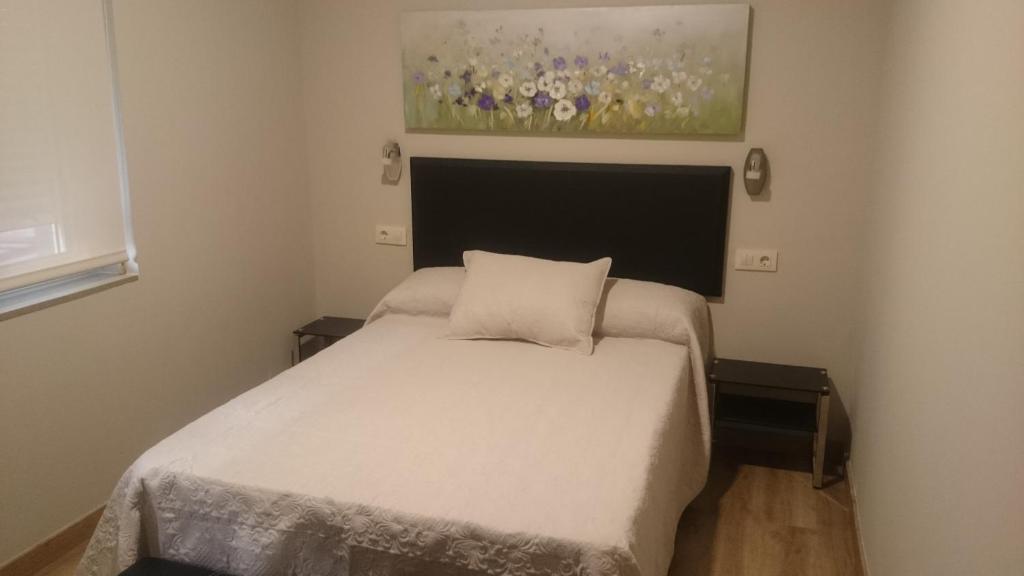 Postel nebo postele na pokoji v ubytování Apartamentos Mitreo