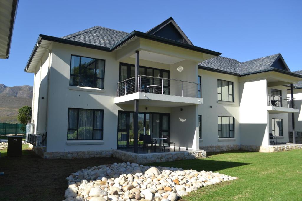 a large white house with a lot of windows at Pearl Valley Suite 504 in Simondium