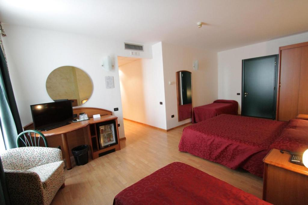Postel nebo postele na pokoji v ubytování Hotel Europa