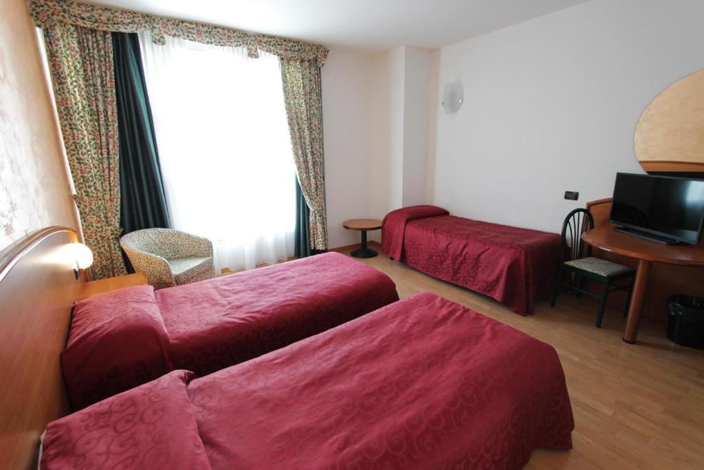 Postel nebo postele na pokoji v ubytování Hotel Europa