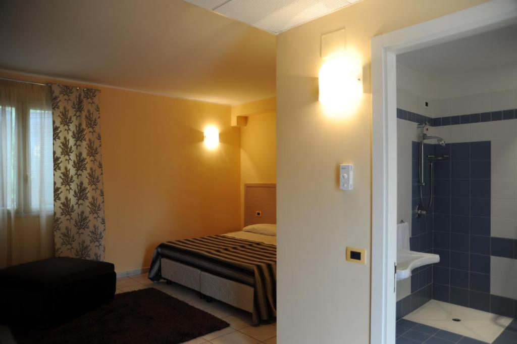 Postel nebo postele na pokoji v ubytování Hotel Bulla Regia