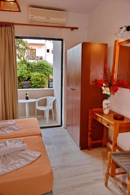 Postel nebo postele na pokoji v ubytování Hotel Anatoli Apartments